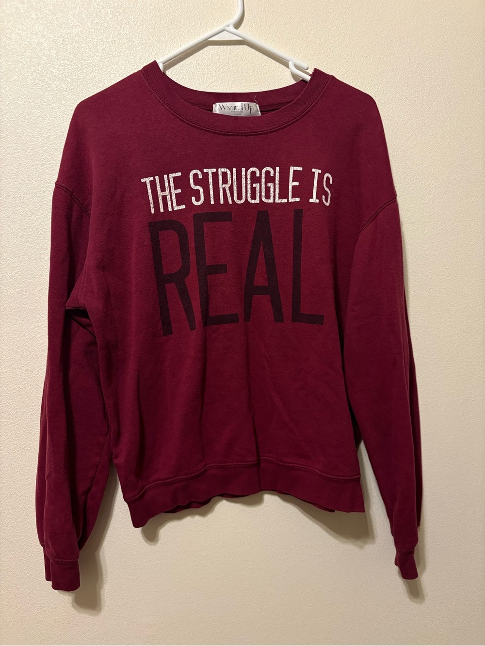 Wound Up Burgundy Crewneck Sweatshirt with "THE STRUGGLE IS REAL" Graphic
